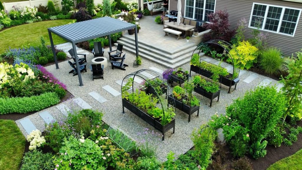 Aerial view of modern backyard with raised beds and pergola