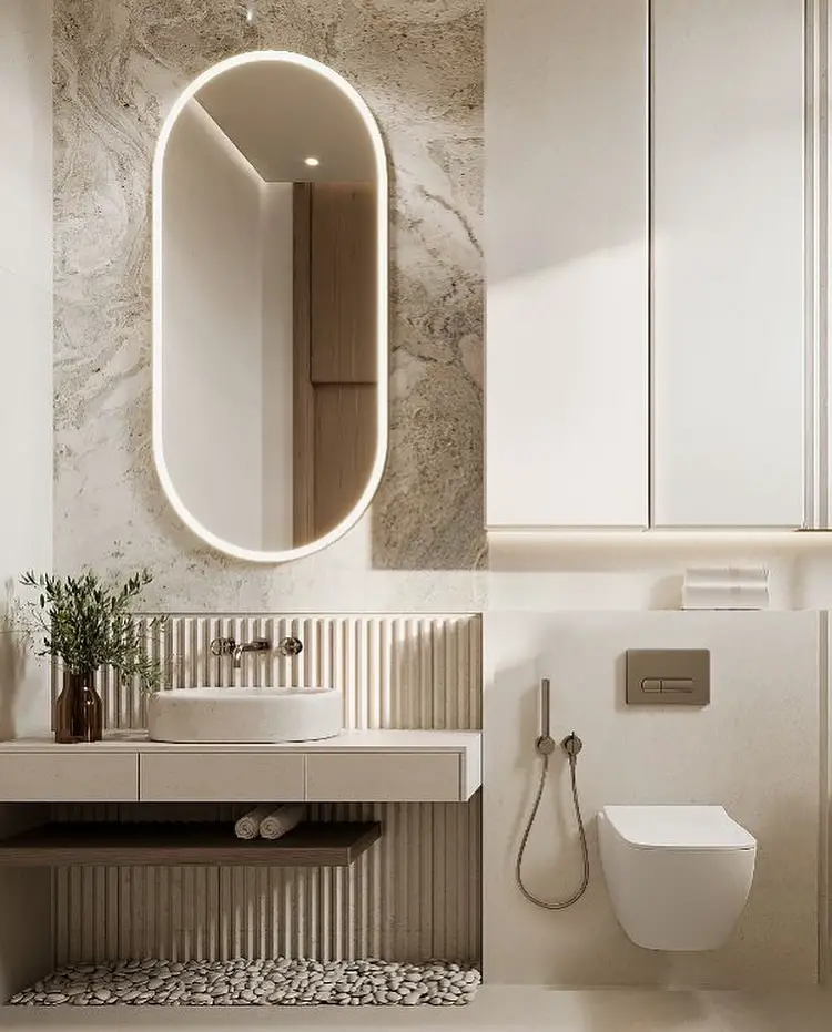 Minimalist powder room with floating vanity LED mirror and river rock detail