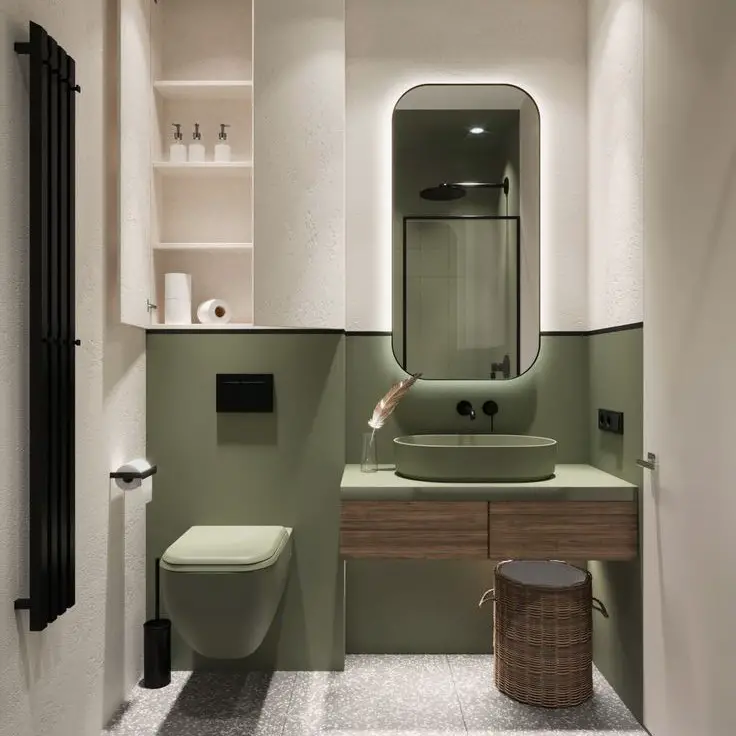 Contemporary powder room with sage green walls floating vanity and curved mirror
