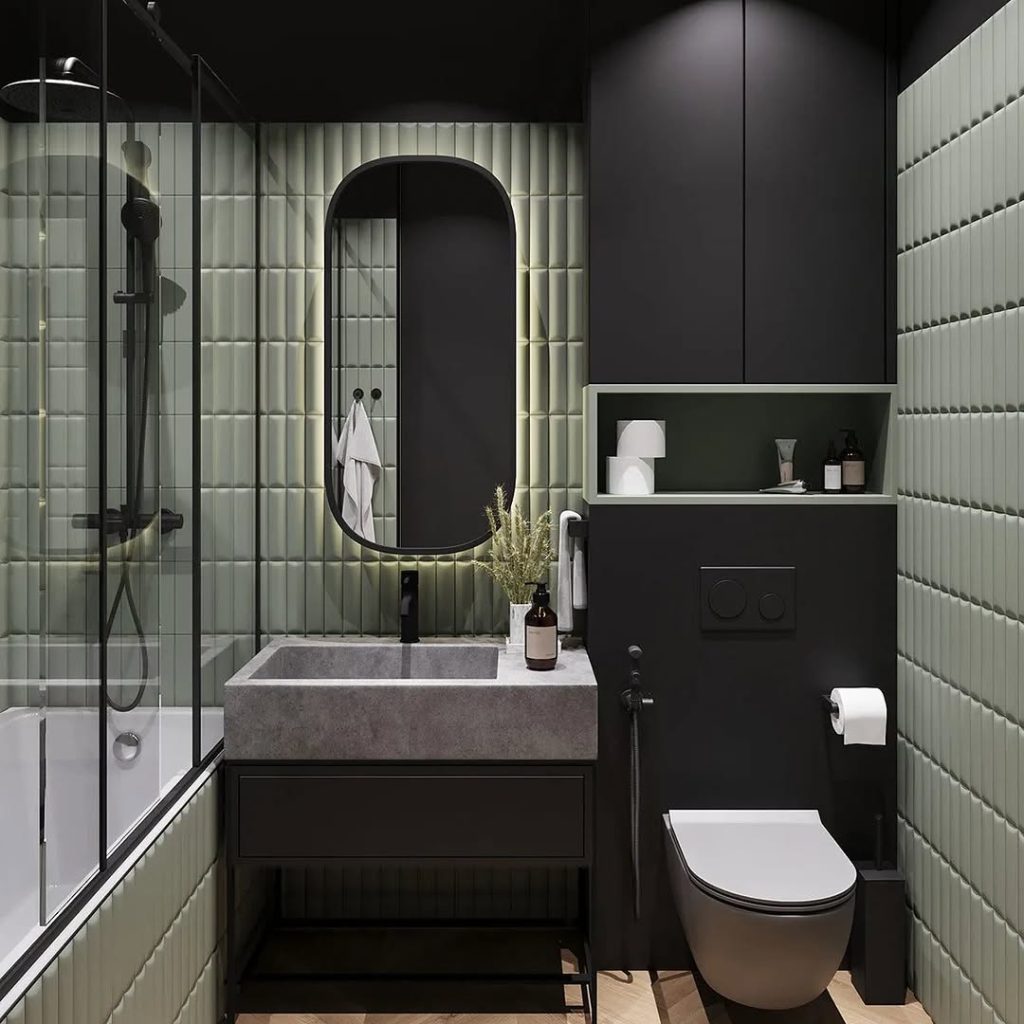 Modern bathroom featuring mint tiles black accents and concrete sink