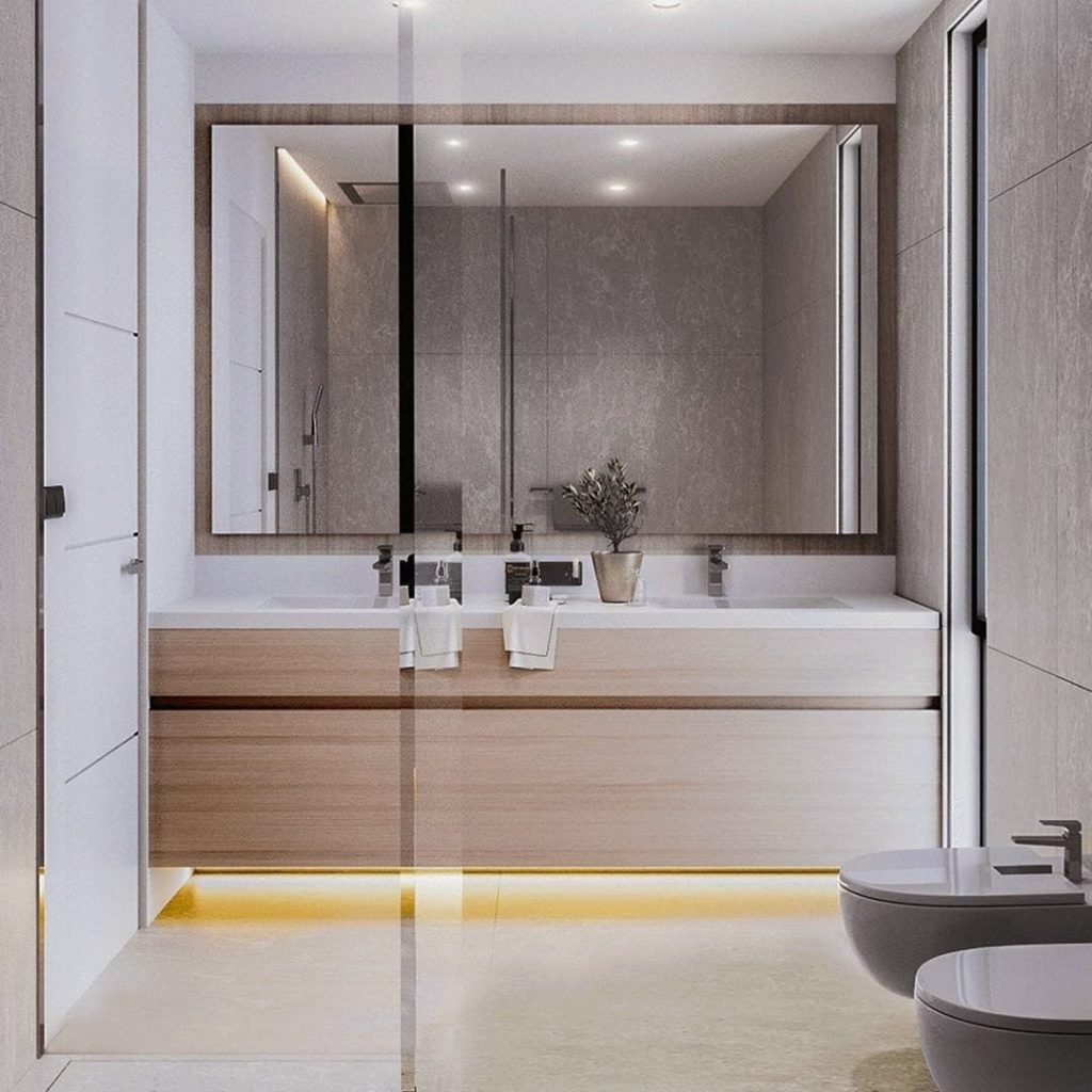 Modern bathroom with floating vanity LED underlighting and large framed mirror