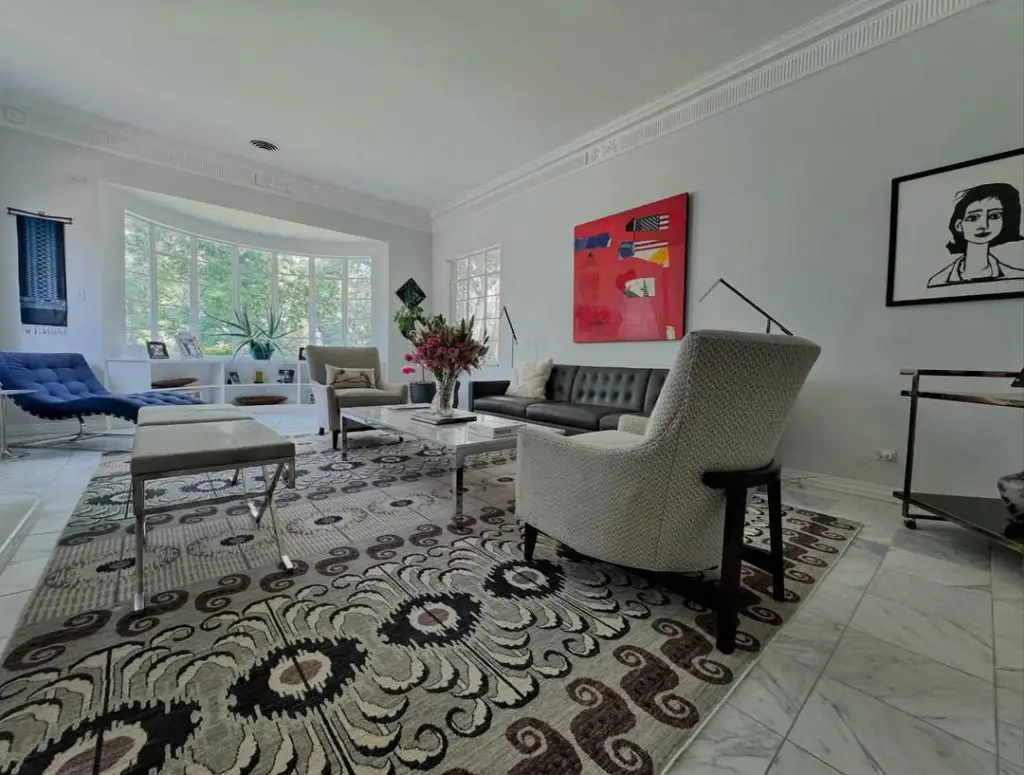 Modern sunroom with contemporary art marble floors and designer furniture