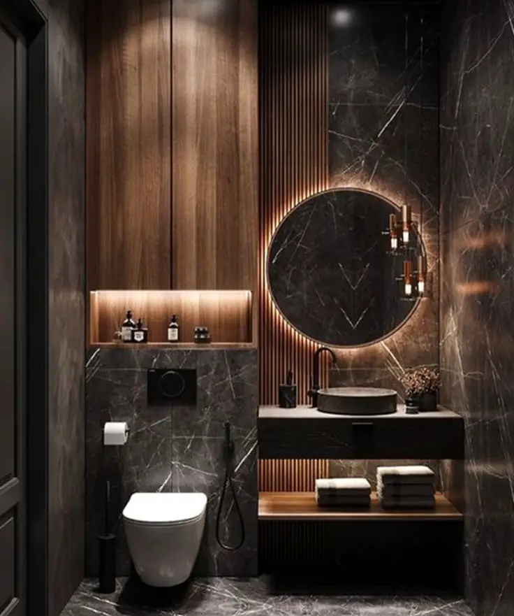 Luxurious dark bathroom with backlit mirror wooden panels and marble walls