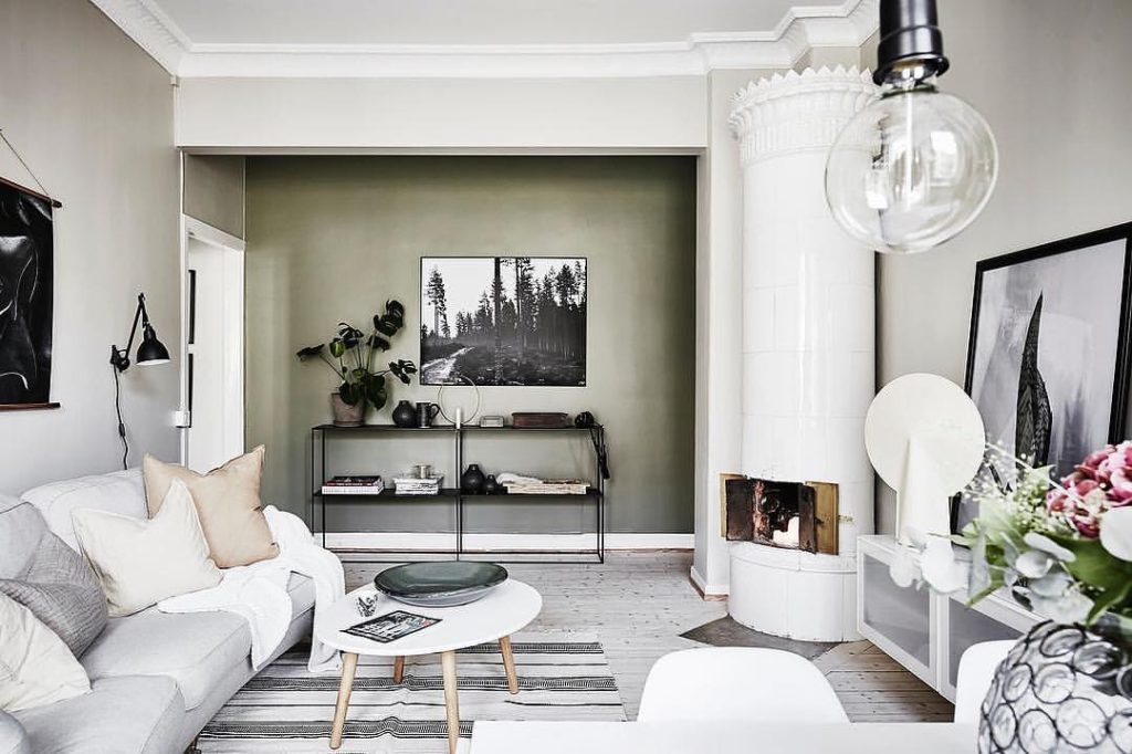 Nordic living room with sage green accent wall