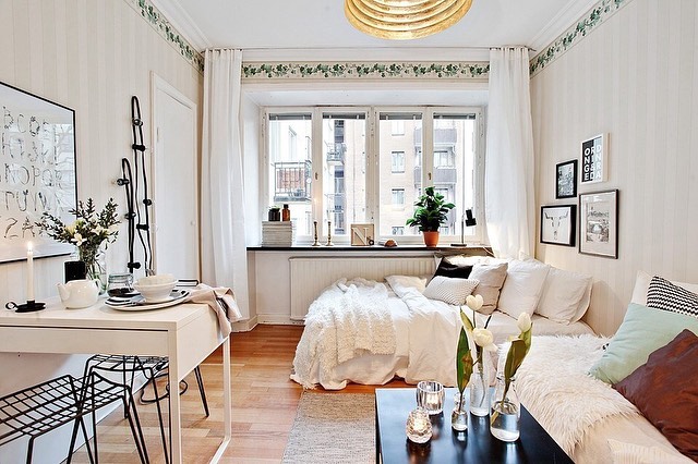 Small Scandinavian bedroom with integrated workspace