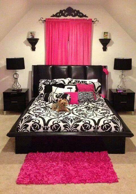 Black and pink bedroom with ornate headboard and matching nightstands
