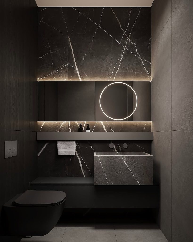 Modern black marble bathroom with floating vanity and LED mirror