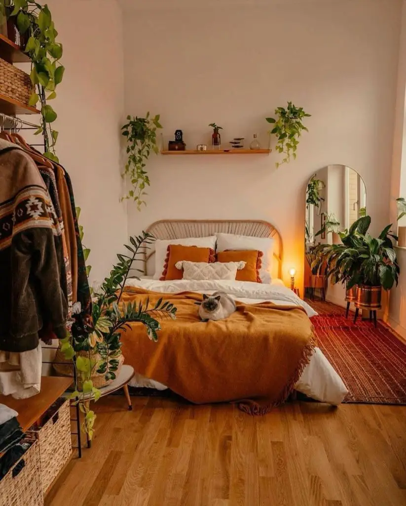 Bohemian bedroom with rattan headboard and hanging plants