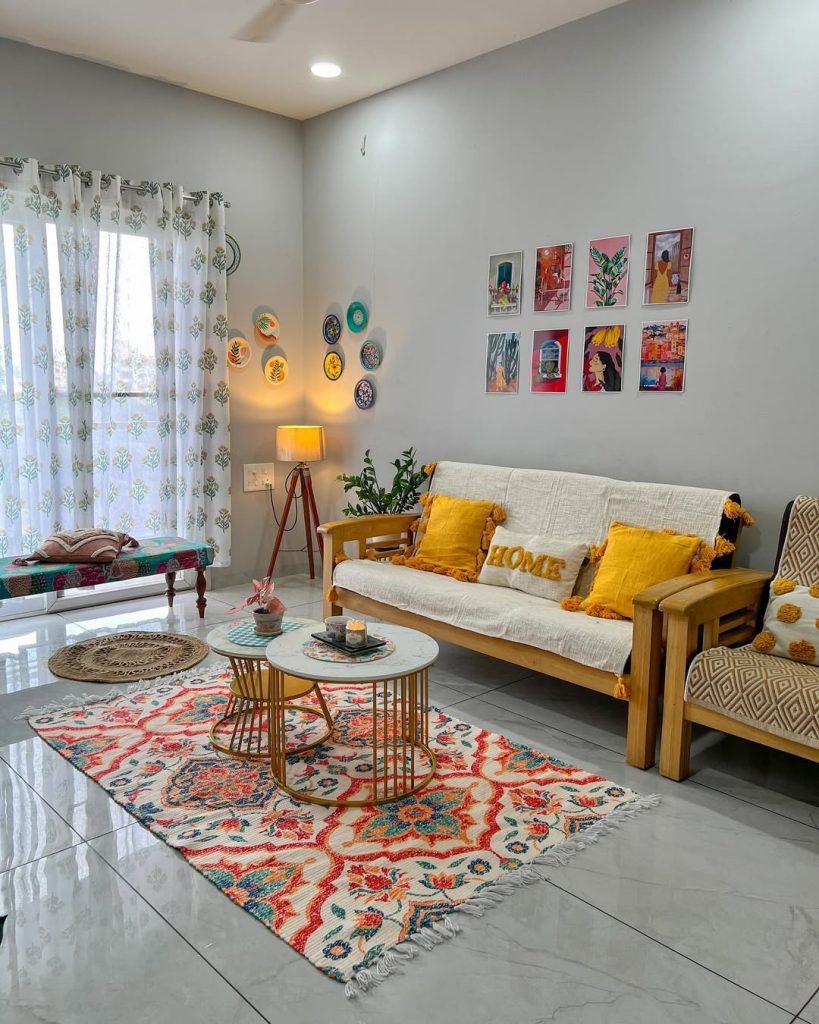 Wooden sofa with yellow pillows and colorful gallery wall display