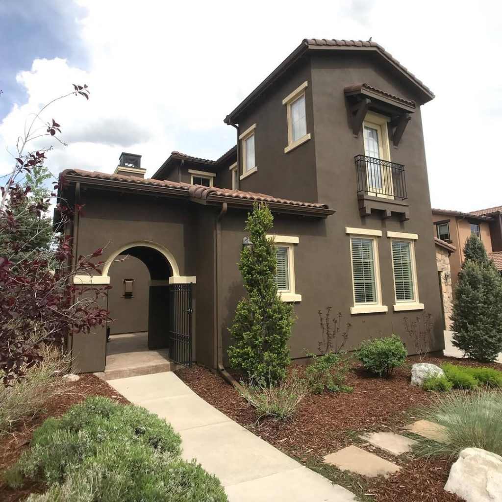 Taupe Mediterranean house with tower iron balcony