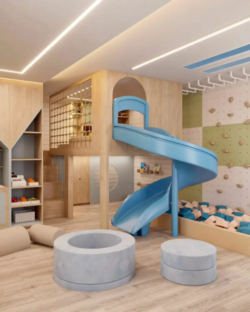Kids bedroom with blue spiral slide and foam block pit