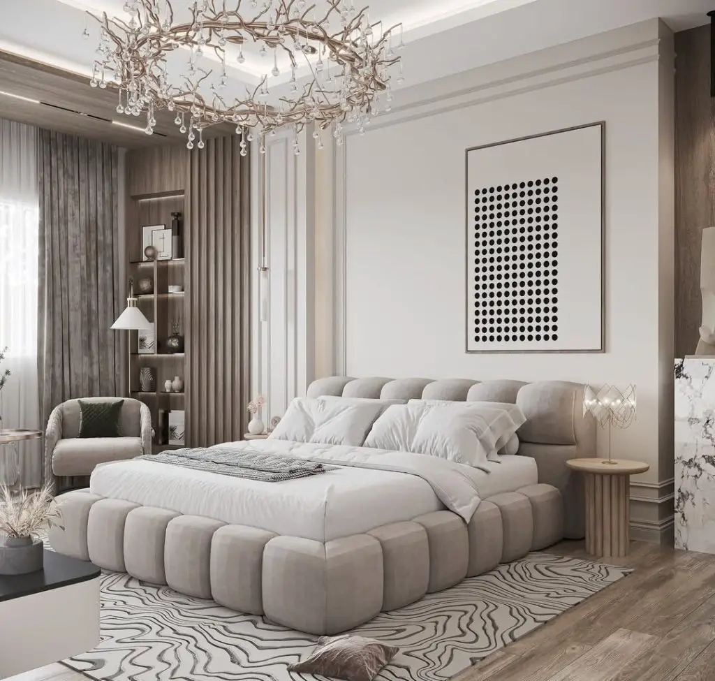 Bedroom with branch chandelier rounded bed frame artwork
