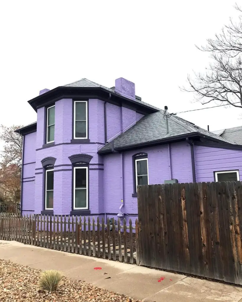 Purple Victorian house with tower bay windows