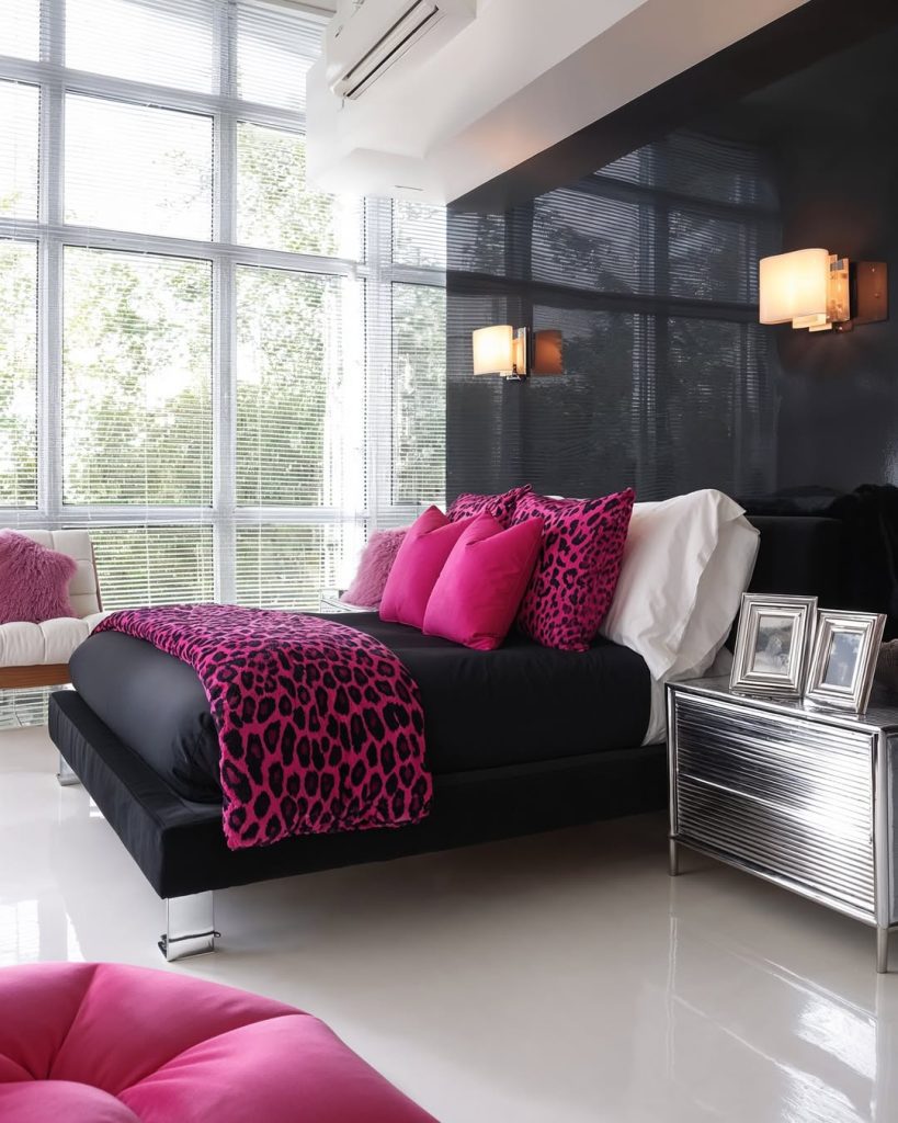 Modern bedroom with leopard print bedding and pink accents
