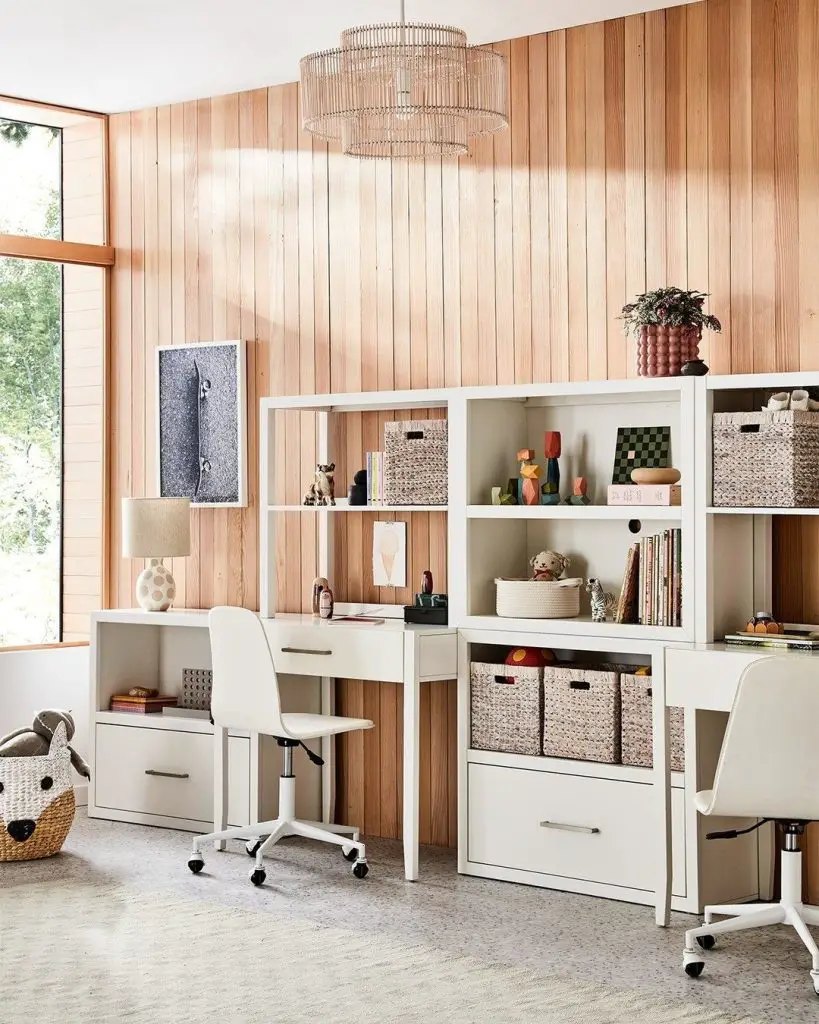 White modular desk system with wood paneling backdrop