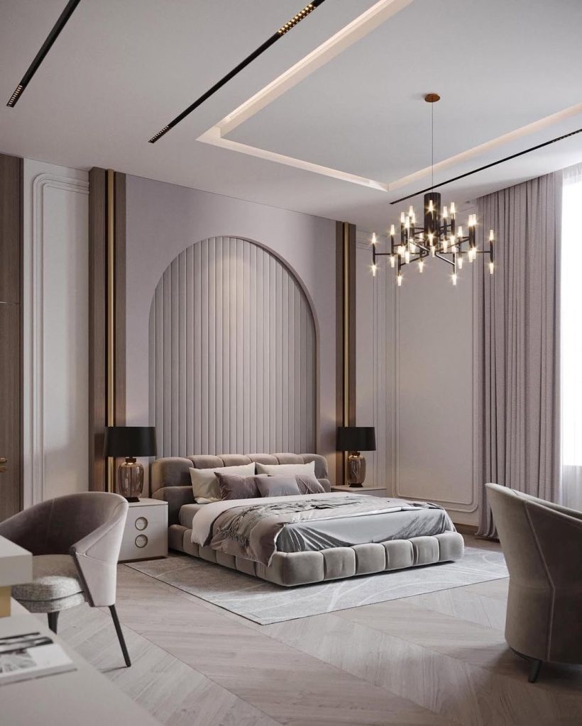 Elegant bedroom with arched headboard and modern chandelier