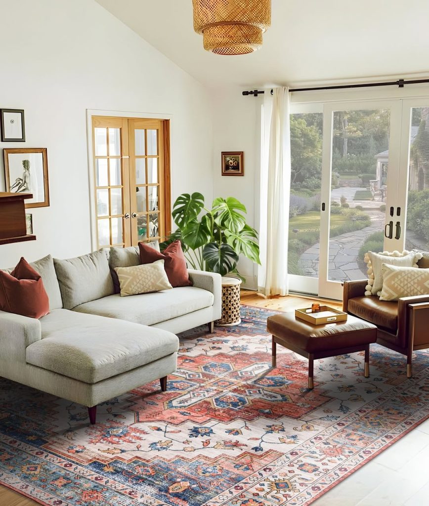 Bohemian living room with patterned rug, mixed textures, leather chair, and natural light