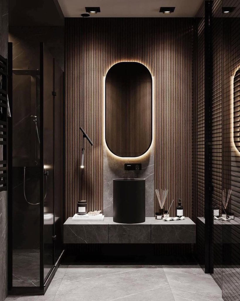 Modern bathroom with wood slats and oval LED mirror