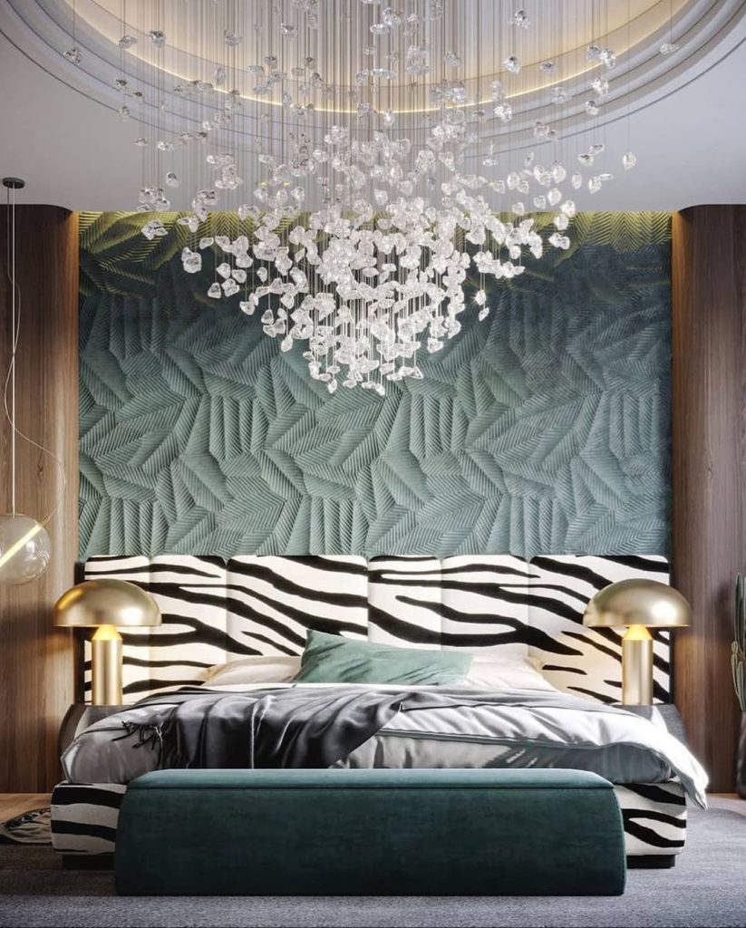Dramatic bedroom with zebra headboard and crystal chandelier