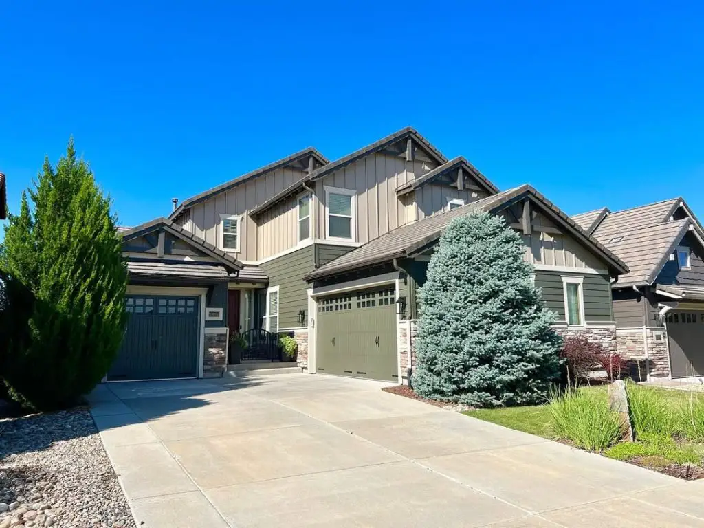 Taupe contemporary house with multiple gables stone