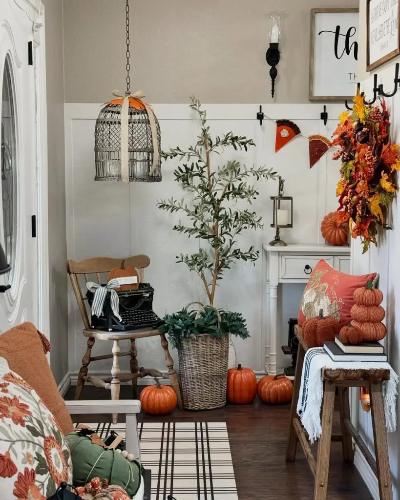 Cozy living room decorated with pumpkins autumn wreath and vintage accessories