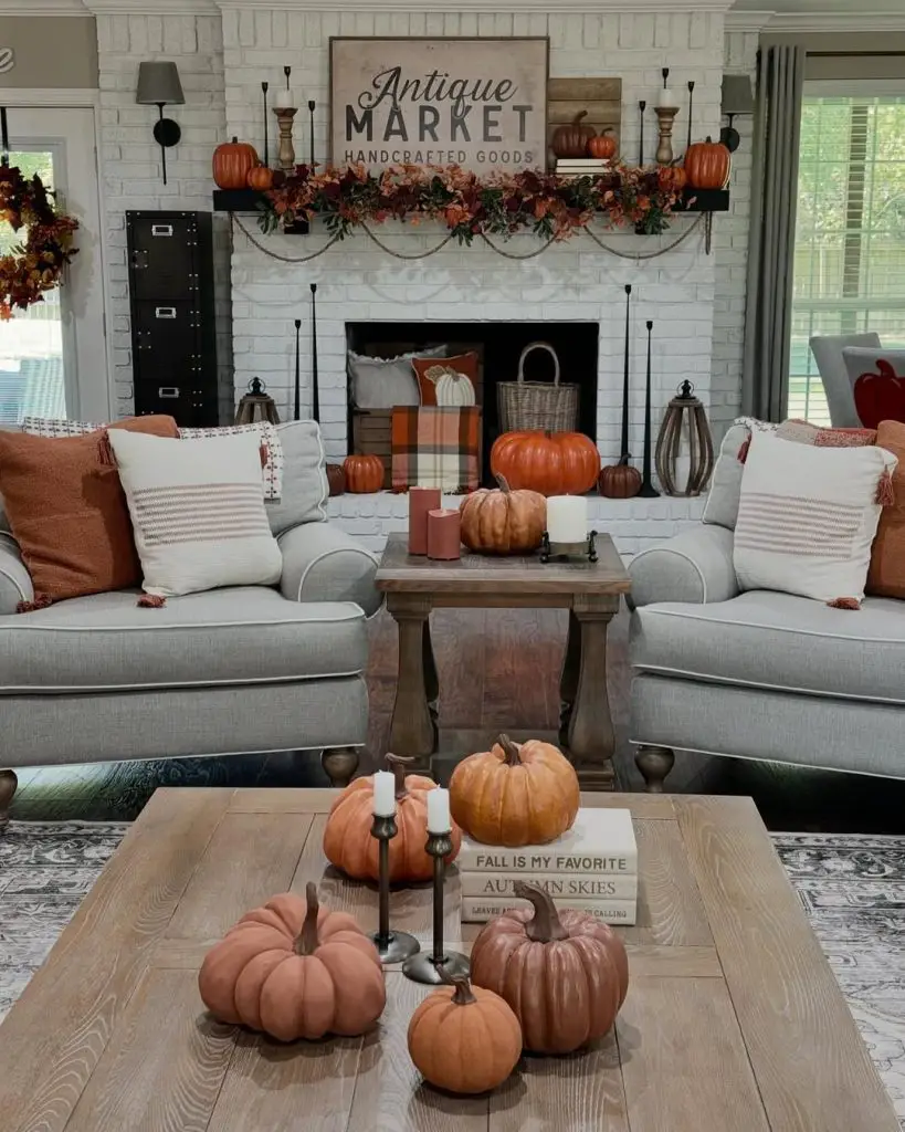Farmhouse living room with fireplace decorated for fall and Halloween