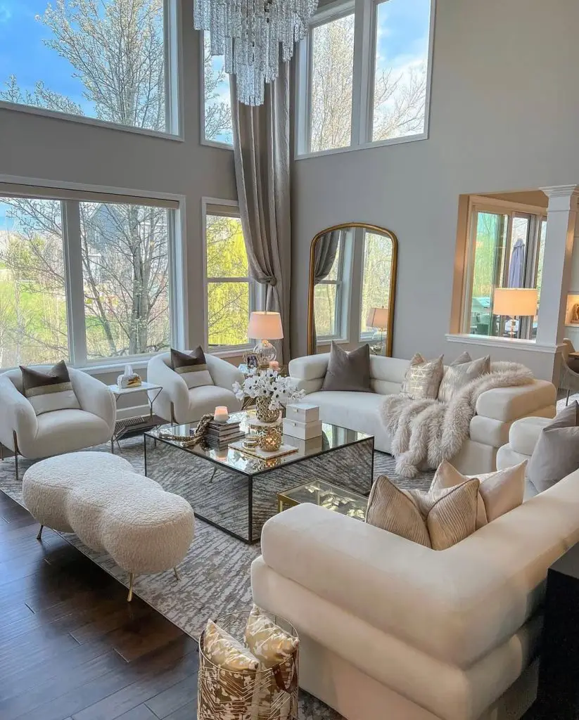 Elegant living room with glass coffee table and crystal chandelier