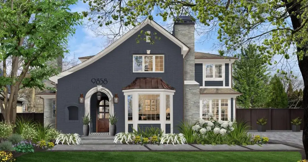Charcoal gray house with stone accents arched entrance