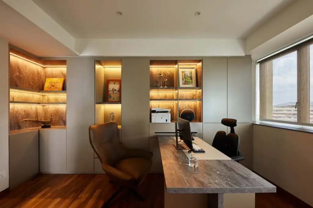 Luxury office with wood shelving and marble desk