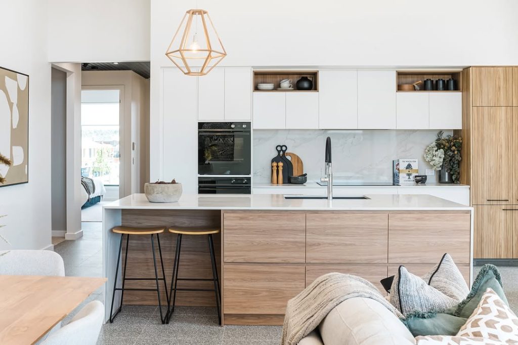 Modern kitchen with geometric pendant light and mixed materials