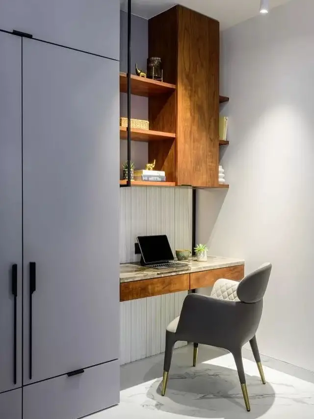 Modern desk with wooden shelving and gray chair