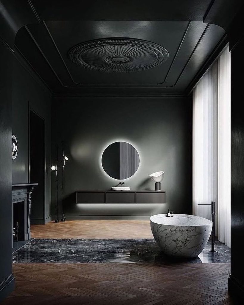 Elegant bathroom with ornate ceiling medallion and marble tub