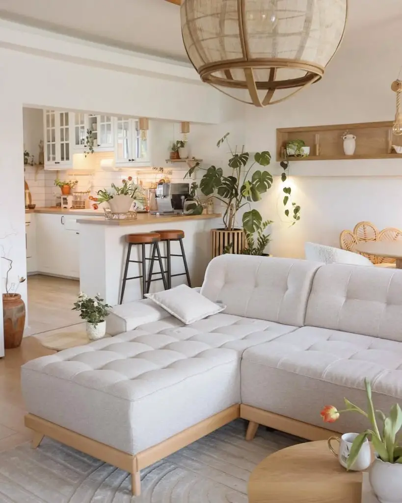 Open concept living room and kitchen with tufted sectional