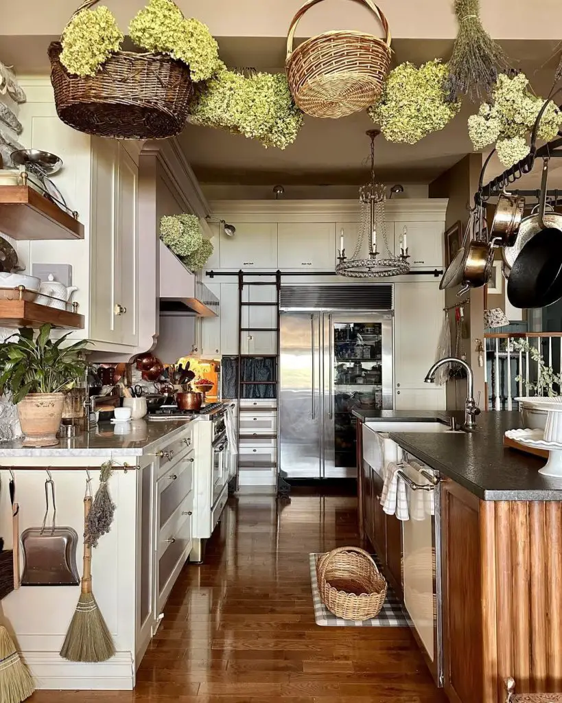 Galley kitchen with dried flowers copper pots herb display