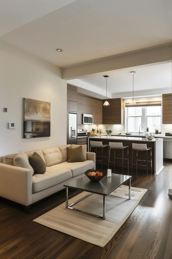 Modern loft kitchen with dark floors and geometric pendant lights