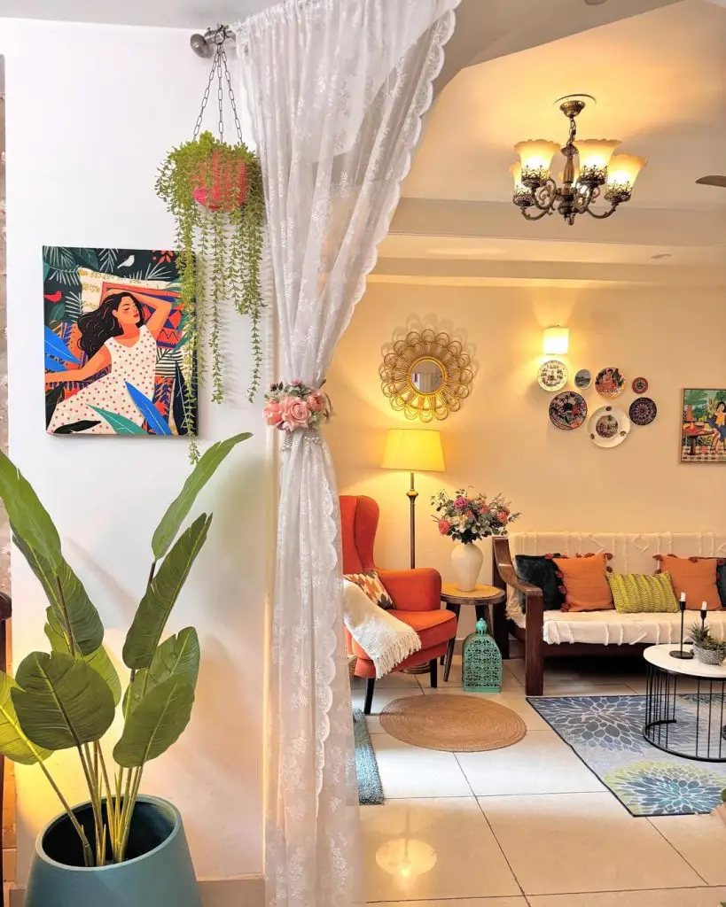 Eclectic living room with colorful gallery wall and orange chair