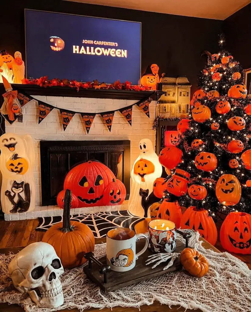 Black Christmas tree decorated with orange Halloween ornaments