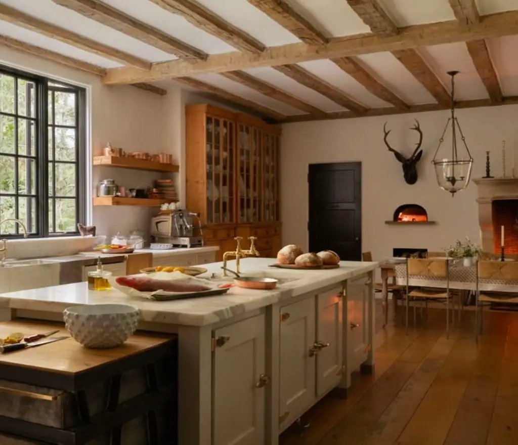 Lodge kitchen with exposed beams deer mount pizza oven