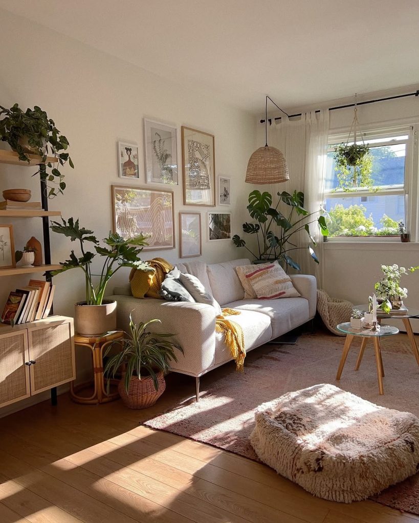 Plant filled living room with gallery wall and natural lighting