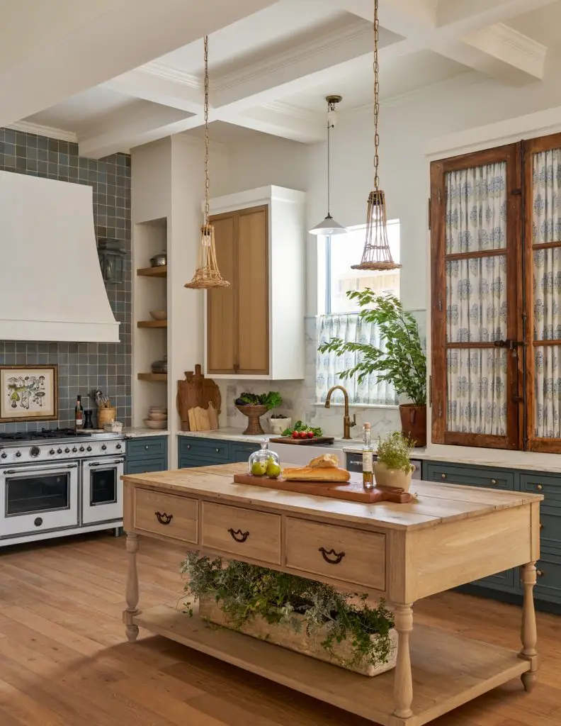 Rustic farmhouse kitchen with wooden island and green cabinets