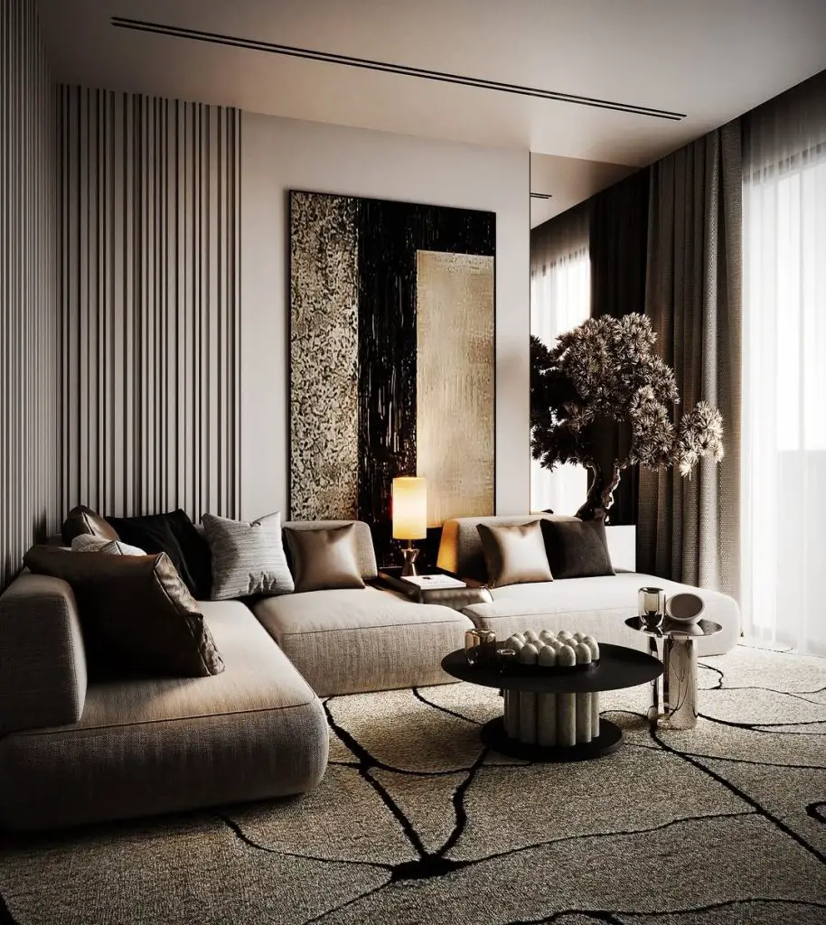 Sophisticated neutral living room with textural paneling and curved sectional
