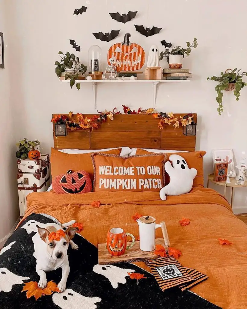 Orange Halloween bedroom with bat decorations and pumpkin accessories
