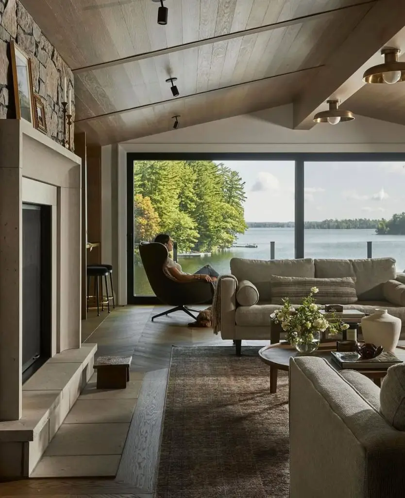  Modern lakefront living room with panoramic windows and water views