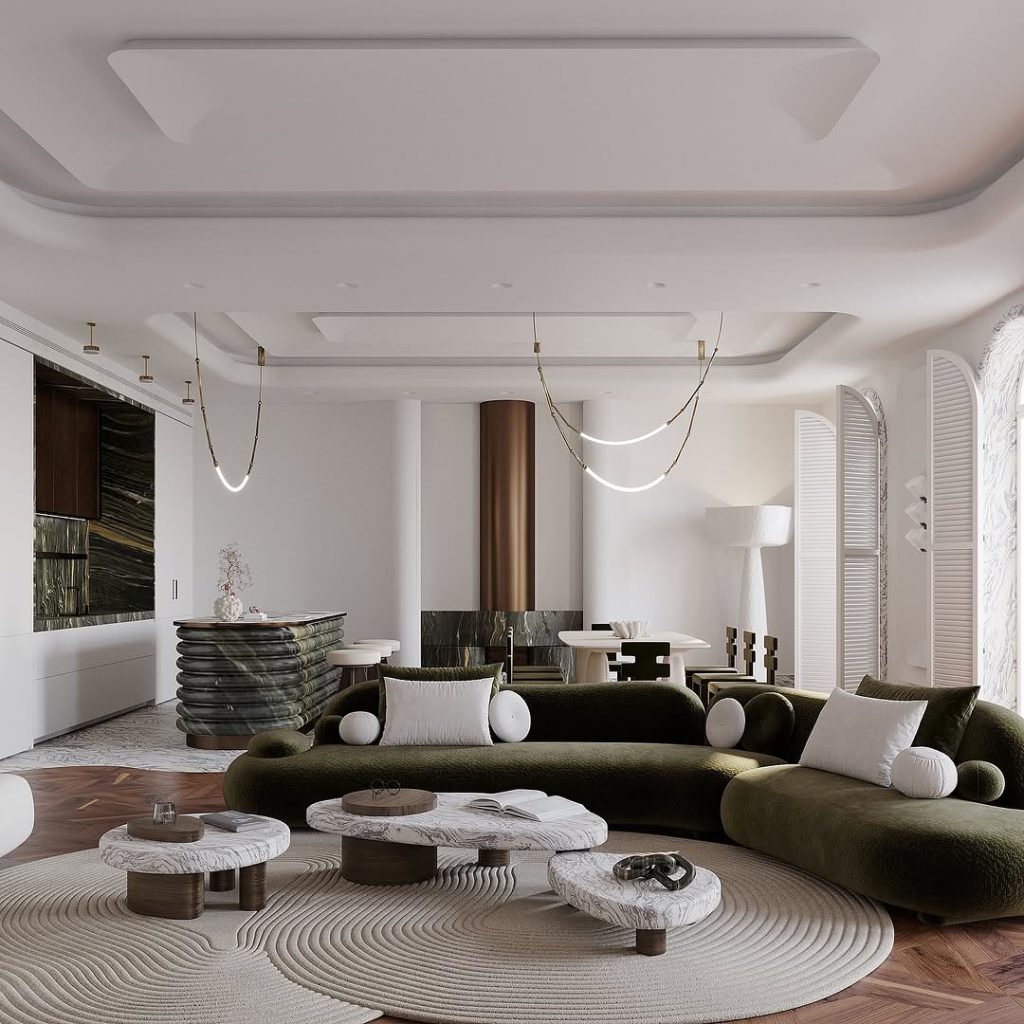 Modern living room with curved lighting, green sofa, and marble tables