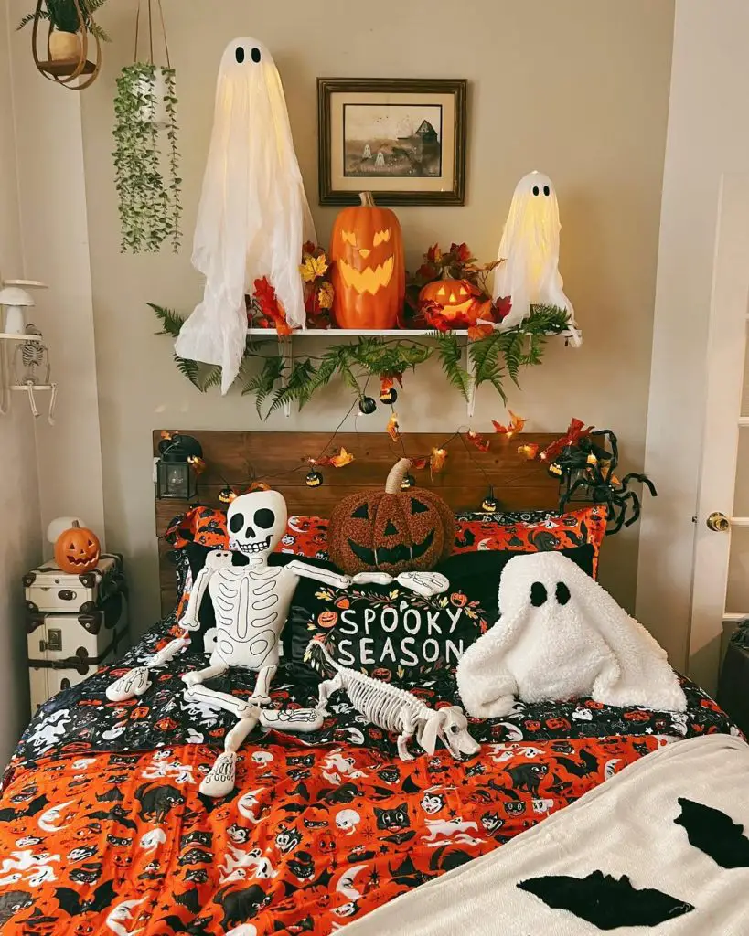 Halloween themed bedroom with skeleton decorations and ghost pillows