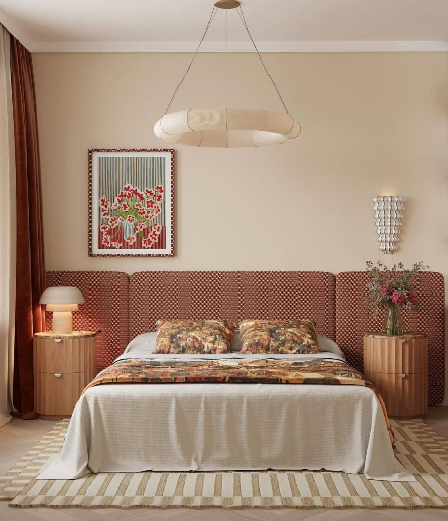 Bedroom with geometric headboard, sculptural chandelier, and patterned textiles