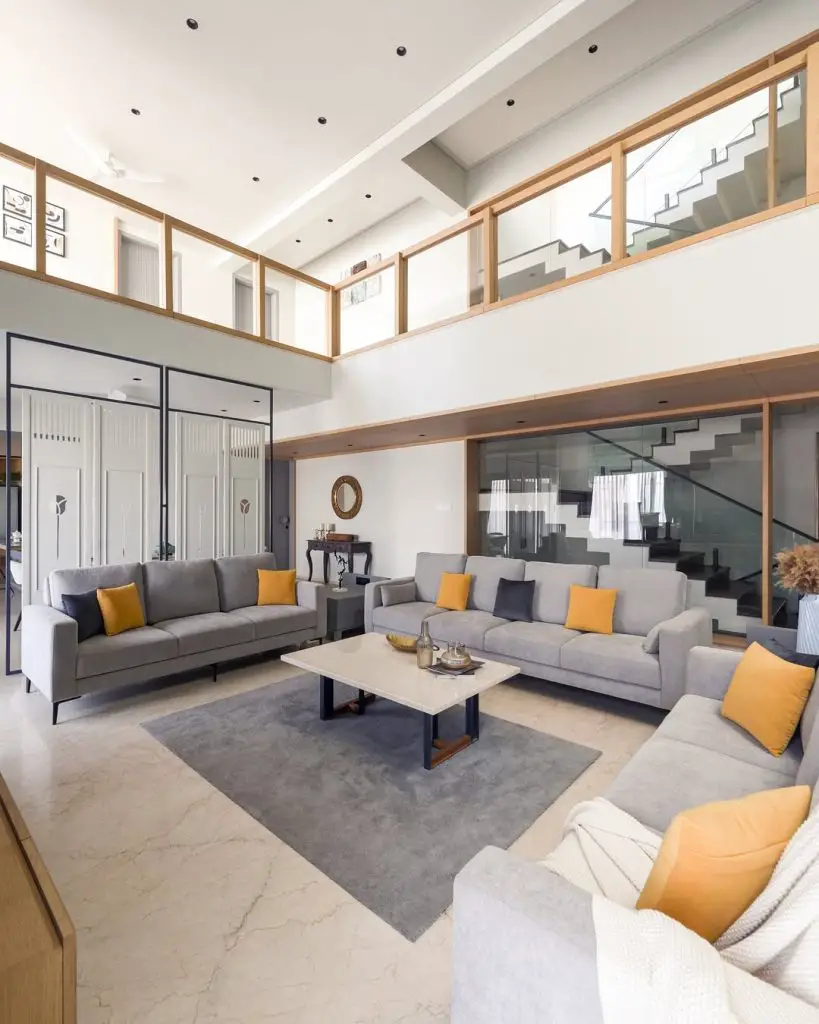 Modern loft living room with high ceilings and mezzanine level