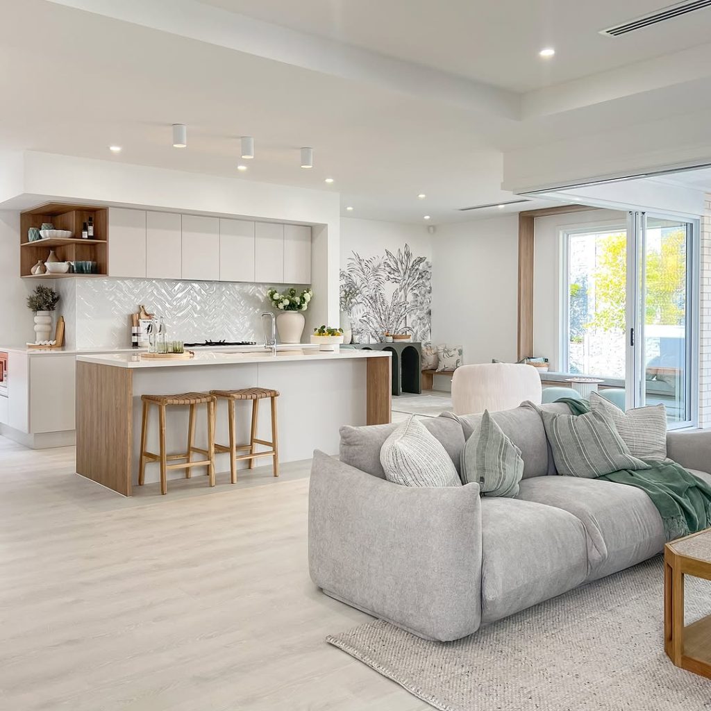 Light neutral kitchen with herringbone backsplash and wooden accents