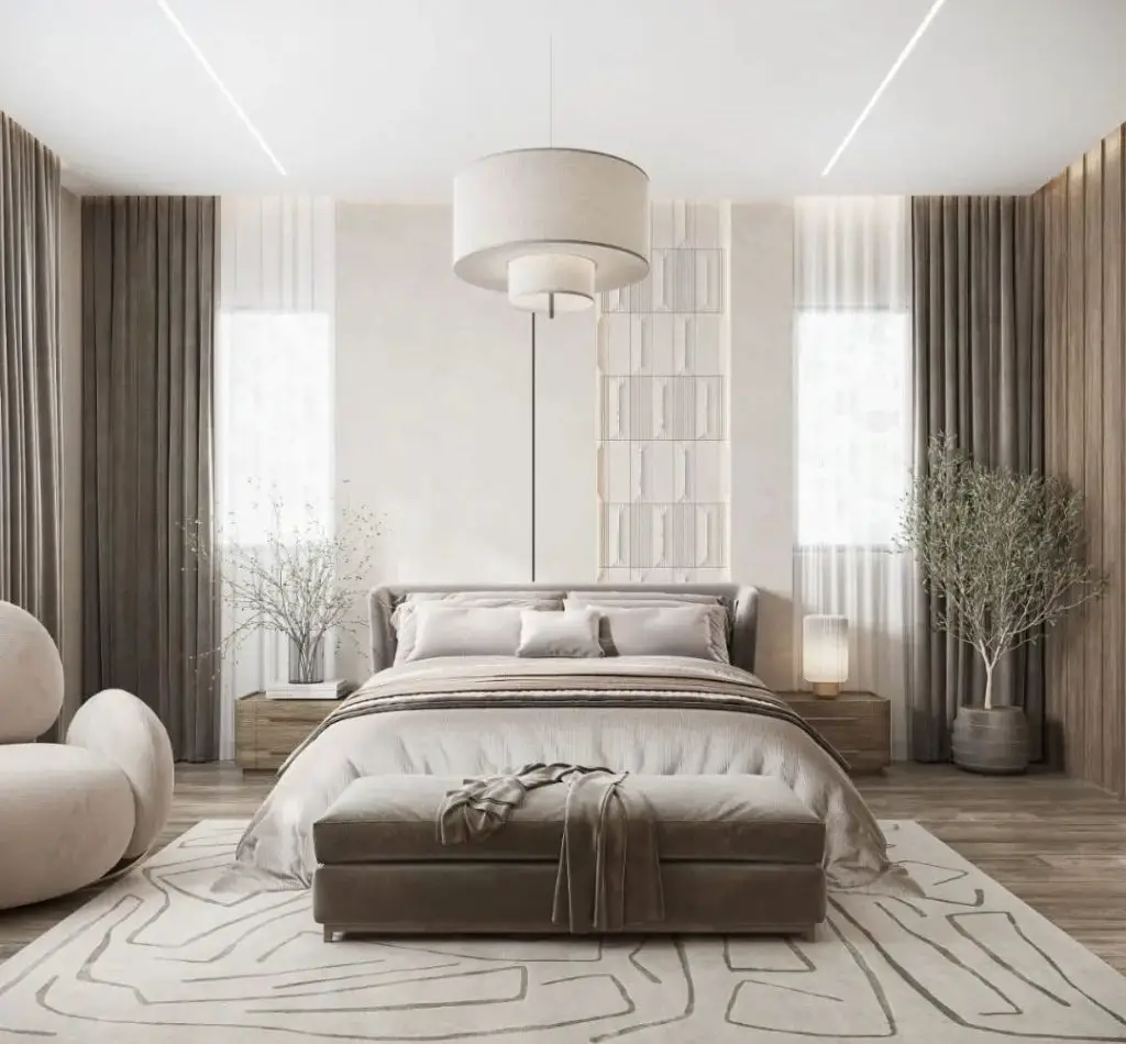 Neutral bedroom with tiered pendant lighting geometric rugs