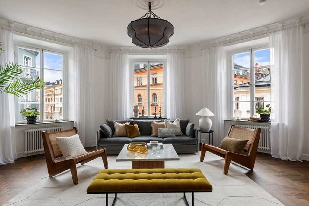 Bright apartment living room with city views and elegant furnishings